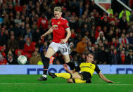 Soccer Football - Carabao Cup Third Round - Manchester United vs Burton Albion - Old Trafford, Manchester, Britain - September 20, 2017 Manchester United's Scott McTominay in action with Burton Albion's Stephen Warnock Action Images via Reuters/Jason Cairnduff