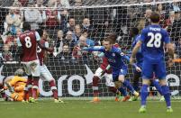 <p>Leicester’s Jamie Vardy, center, celebrates after scoring during the English Premier League soccer match between West Ham and Leicester City at London Stadium in London, Saturday, March 18, 2017. (AP Photo/Frank Augstein) </p>