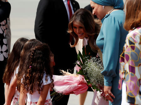 U.S. first lady Melania Trump greets children as she arrives in Cairo, Egypt, October 6, 2018. REUTERS/Carlo Allegri