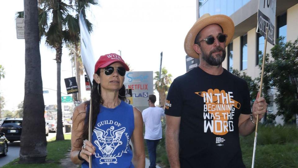 PHOTO: Justine Bateman and Noah Wylie walk the picket line in support of the SAG-AFTRA and WGA strike on Aug. 23, 2023 at Paramount Studios in Hollywood, Calif. (Jfizzy/star Max/GC Images via Getty Images, FILE)