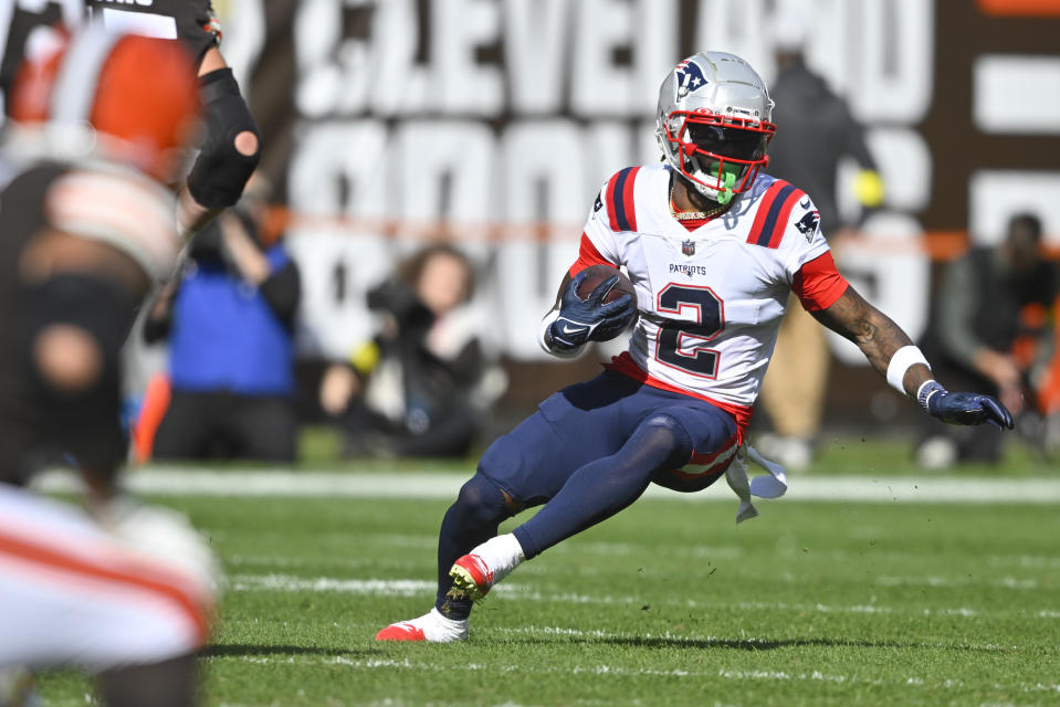 New England Patriots cornerback Jalen Mills (2) runs with the ball after making an interception against the Cleveland Browns during the second half of an NFL football game, Sunday, Oct. 16, 2022, in Cleveland. (AP Photo/David Richard)