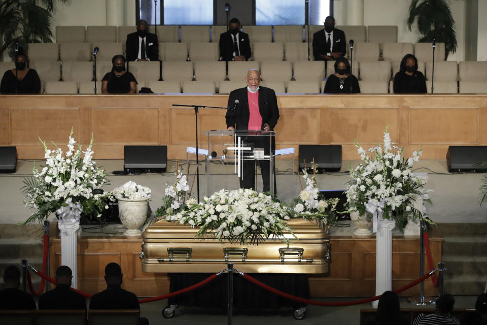 A pastor prays over the casket for Robert Fuller during a funeral in his honor Tuesday, June 30, 2020, in Littlerock, Calif. Fuller, a 24-year-old Black man was found hanging from a tree in a park in a Southern California high desert city. Authorities initially said the death of Fuller appeared to be a suicide but protests led to further investigation, which continues. (AP Photo/Marcio Jose Sanchez)