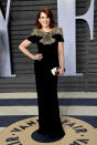 <p>Karen Walker would most certainly approve of Mullaly’s chic black dress with a gold embellished bodice. (Photo: Evan Agostini/Invision/AP) </p>