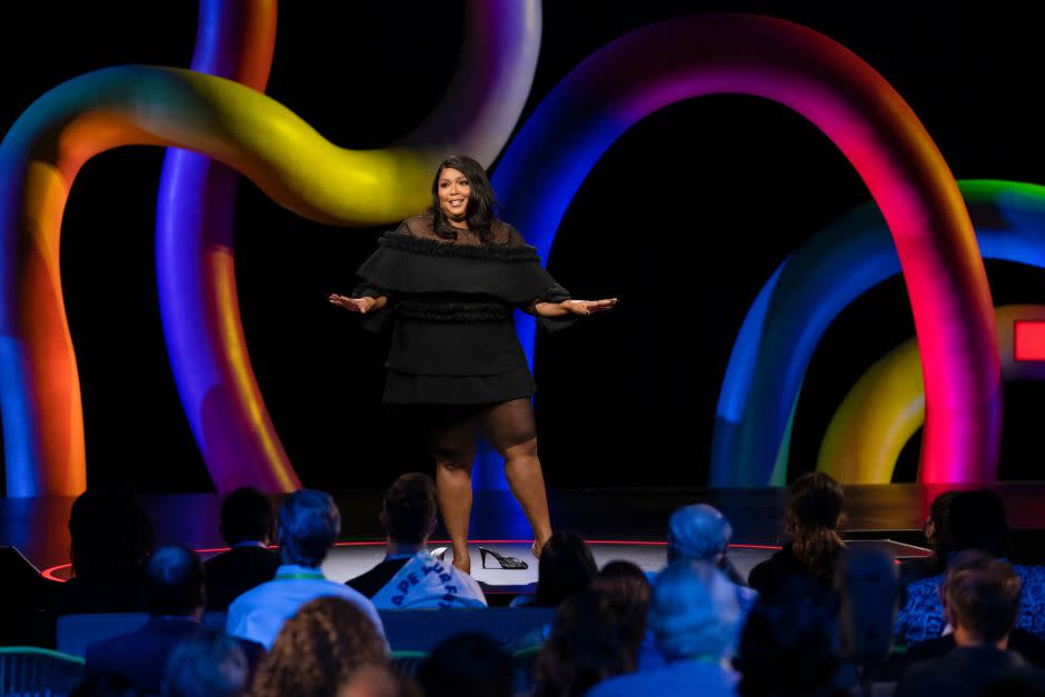 Lizzo framed by David Korins's colorful stage at TEDMonterey 2021.