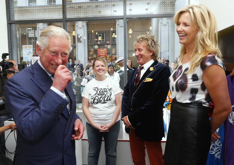 King Charles III jokes with Sir Rod Stewart and Penny Lancaster during the opening of a Prince's Trust shop in London in 2013. (PA)