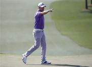 Sweden's Jonas Blixt reacts after his par putt on the seventh hole during the third round of the Masters golf tournament at the Augusta National Golf Club in Augusta, Georgia April 12, 2014. REUTERS/Jim Young