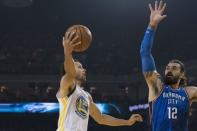 October 16, 2018; Oakland, CA, USA; Golden State Warriors guard Stephen Curry (30) shoots the basketball against Oklahoma City Thunder center Steven Adams (12) during the first quarter at Oracle Arena. Mandatory Credit: Kyle Terada-USA TODAY Sports