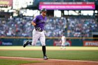 Aug 10, 2018; Denver, CO, USA; Colorado Rockies second baseman DJ LeMahieu (9) rounds the bases after hitting a two run home run in the first inning against the Los Angeles Dodgers at Coors Field. Mandatory Credit: Isaiah J. Downing-USA TODAY Sports