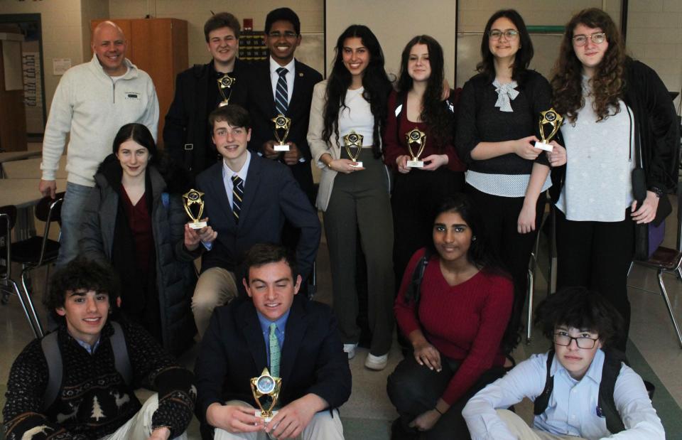 The Portsmouth High School debate team includes, in front row: Emilio Pruna, Miles, Borne, Rithika Rajavel and James Margeson. Second row: Isobel Horowitz, Ian FranasBack row: coach Joe Kraus, Owen Coffey, Marlon Pinto, Mariam Nada, Hailey Venuto, Bahar Altindis and Nina Cummins.