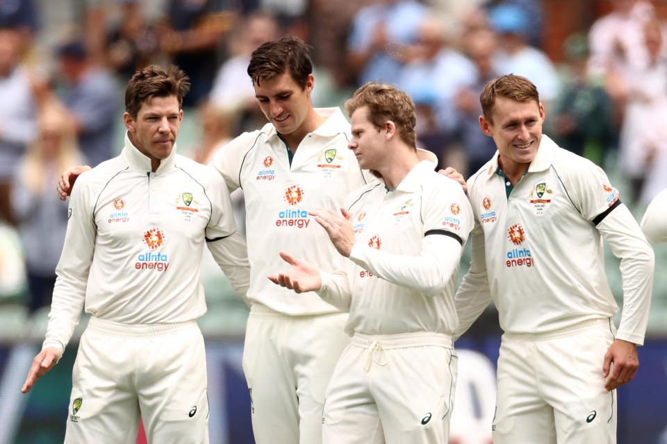 Former captain Tim Paine (pictured left) and Pat Cummins (pictured second left) Steve Smith (pictured second right) and Marnus Labuschagne (pictured right) walking off the field.