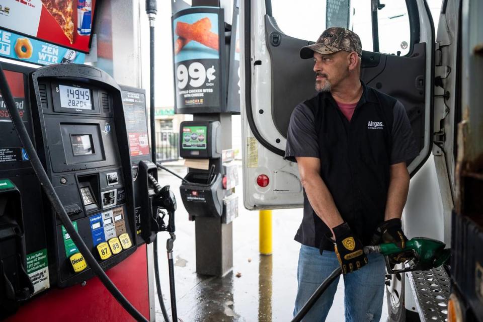 Tony Roman pumps diesel gas into a work truck at the QuikTrip on North Graham Street on Wednesday, March 9, 2022 in Charlotte. Roman shared that diesel was $4.29 per gallon when he filled up last week; today it was $5.29 per gallon. As he was filling it up it started to slow as the total price neared $150. He said We get a fleet card for gas and my limit was $200, but I guess its only $150 now. Roman, who lives in Mooresville, said if gas prices get any higher he will not be able to afford to make the commute with his personal truck.