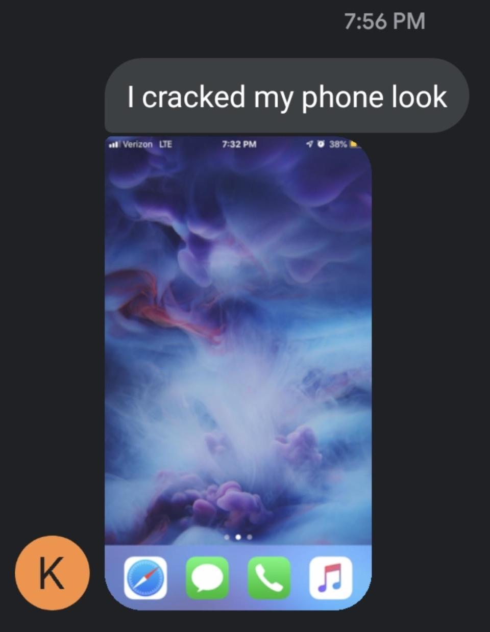 Screenshot of a smartphone's home screen with visible icons and a celestial scene, with text message saying "I cracked my phone look"