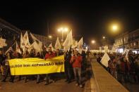 Demonstrators march during a protest in Lisbon March 6, 2014. REUTERS/Hugo Correia