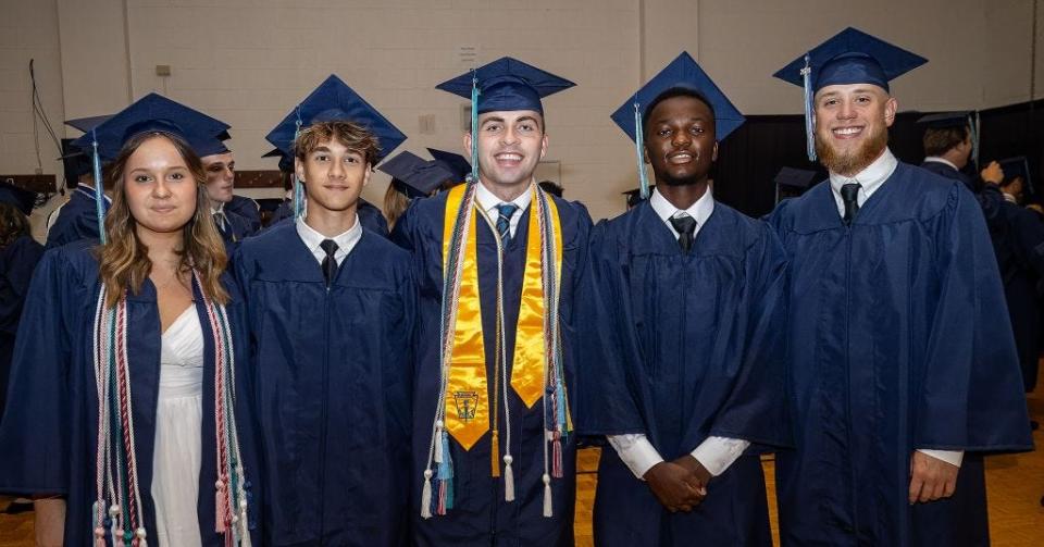 Haley Johnson, Alex Johnstone, Jack Lane, Abudala Mombwe and Blake Schofield at Siegel High School graduation at MTSU’s Murphy Center on Tuesday, May 14, 2024.