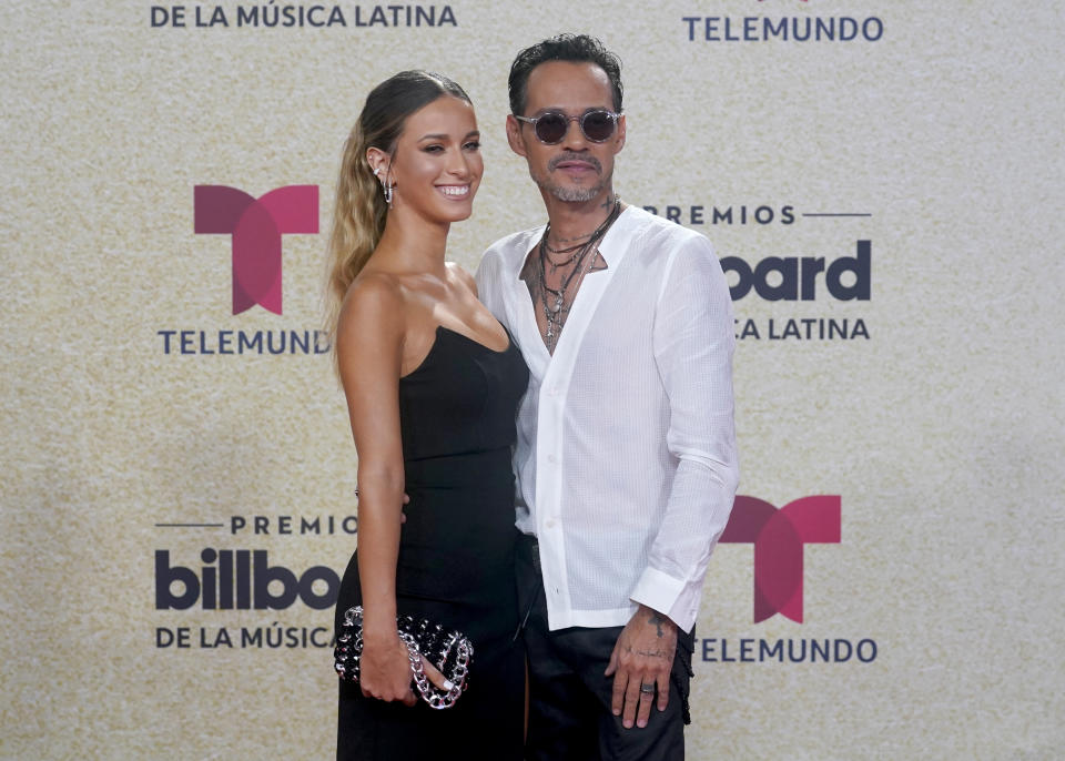 Marc Anthony, right, arrives at the Billboard Latin Music Awards on Thursday, Sept. 23, 2021, at the Watsco Center in Coral Gables, Fla. (AP Photo/Marta Lavandier)