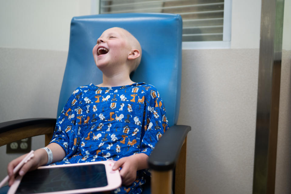 Callie Weatherford, 6, lets out a laugh at Children's National Hospital in D.C., where she is taking part in a clinical trial that uses ultrasound technology to treat a childhood cancer called DIPG. (Washington Post photo by Minh Connors)