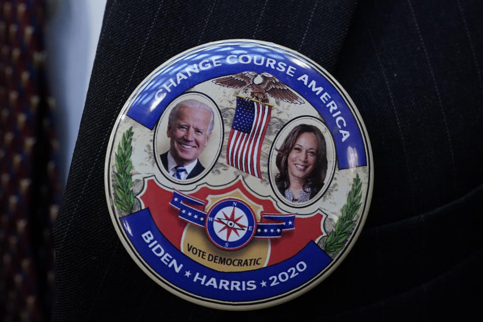 A Joe Biden/Kamala Harris election button. The new administration has pledged to make tackling the climate crisis a priority. (Photo: CARLOS OSORIO/POOL/AFP via Getty Images)