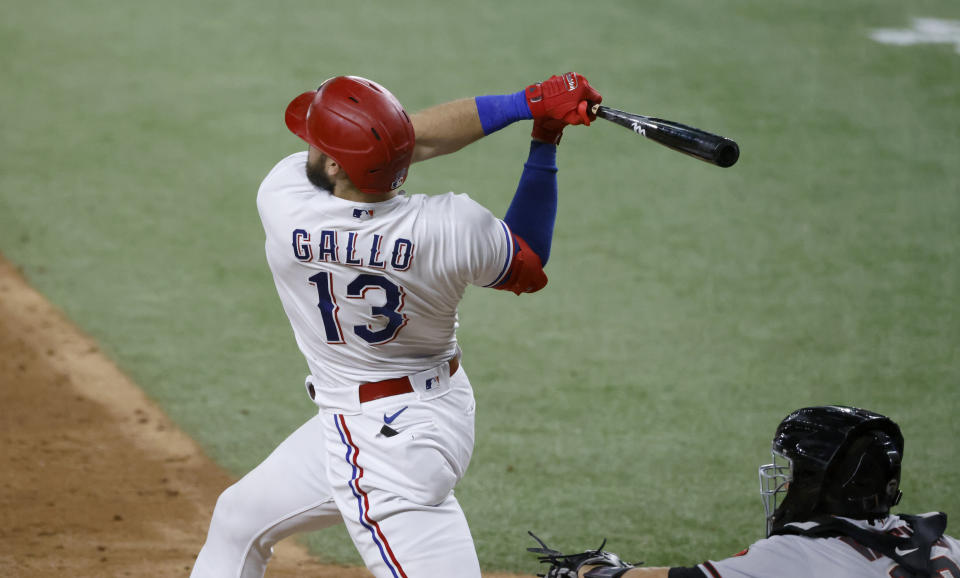 ARLINGTON, TX - JULY 27: Joey Gallo #13 of the Texas Rangers hits a three-run home run against the Arizona Diamondbacks during the fourth inning at Globe Life Field on July 27, 2021 in Arlington, Texas. (Photo by Ron Jenkins/Getty Images)