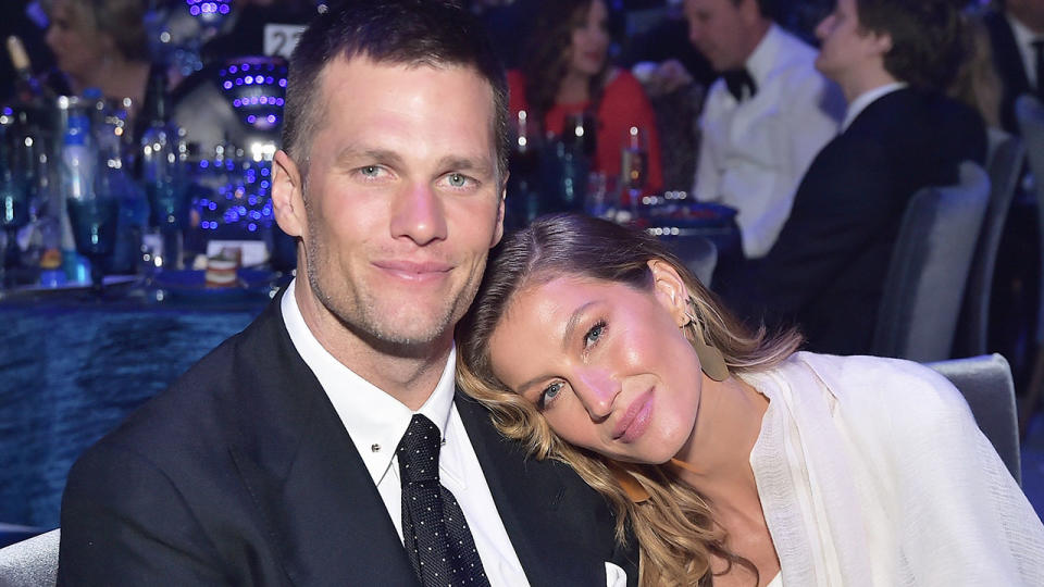 Pictured here, Tom Brady and his wife Gisele Bundchen pose for a photo together.