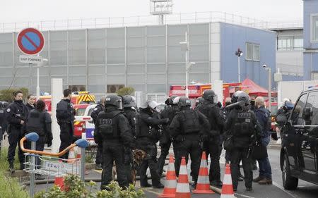 Police take up position at Orly airport southern terminal after a shooting incident near Paris, France, March 18, 2016. REUTERS/Benoit Tessier