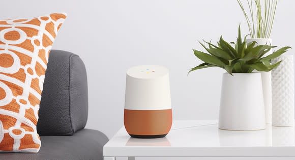 A Google Home device on a side table.