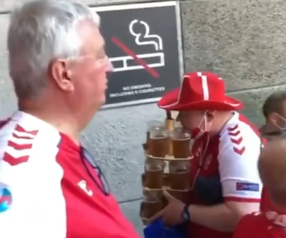 Denmark is excelling at Euro 2020, but this dude carrying like 14 giant beers (and a bottle of wine?) without flinching is the only Danish hero we need.