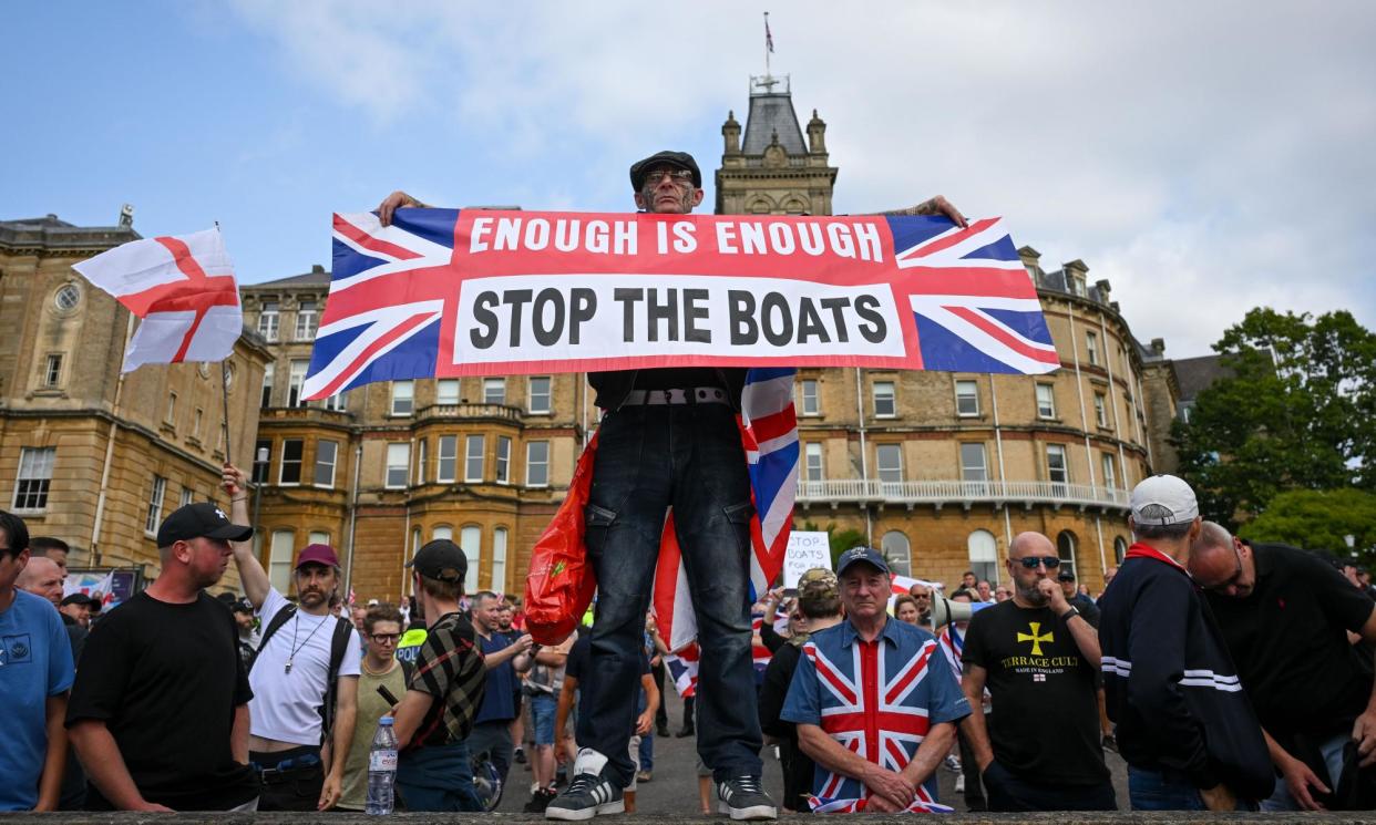 <span>An anti-immigration group in Bournemouth made use of the ‘enough is enough’ slogan that has become common at such events.</span><span>Photograph: Finnbarr Webster/Getty Images</span>