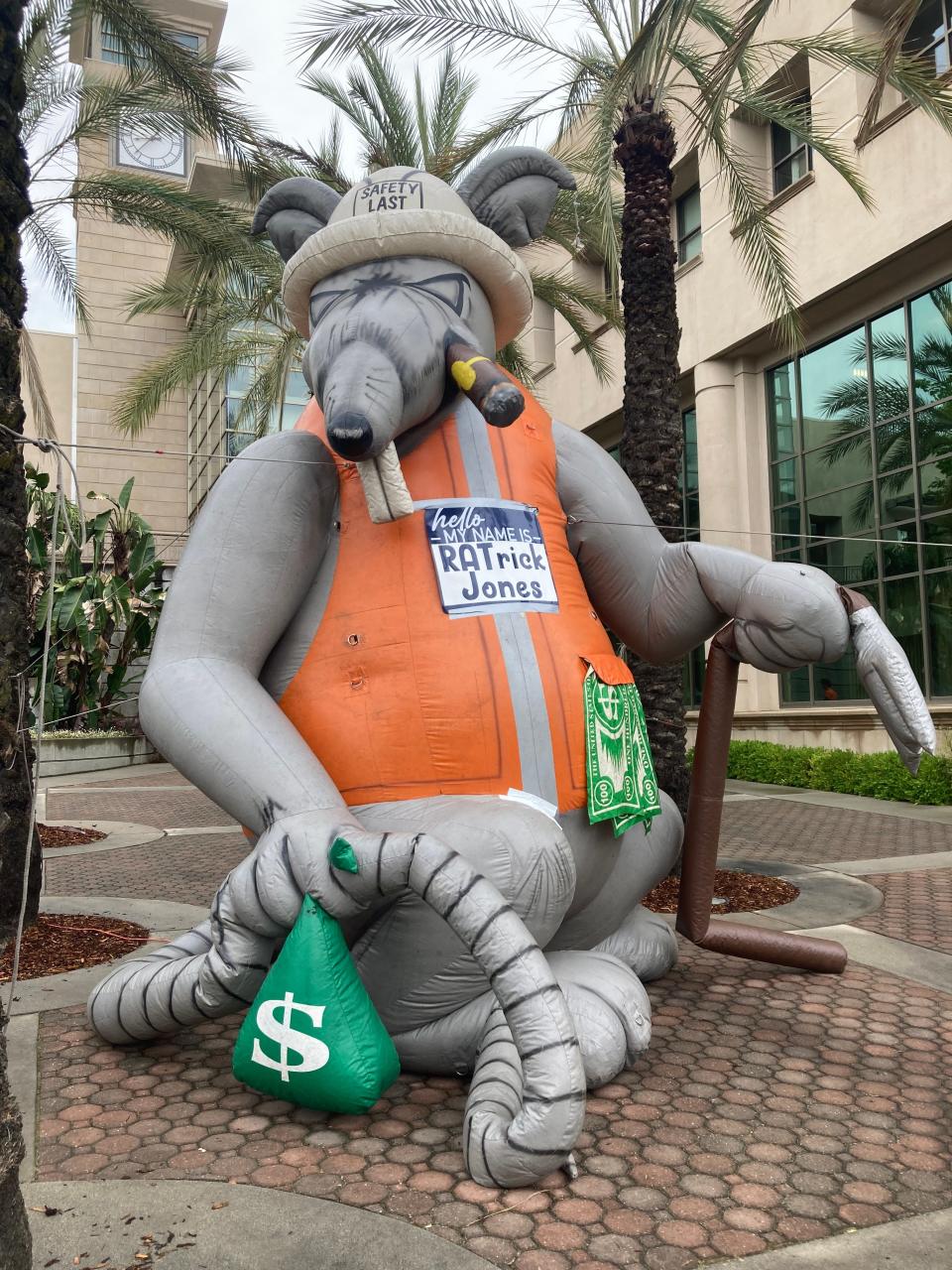 An inflatable rat named "RATrick" Jones sits along Court Street earlier this month during the UPEC Local 792 strike.