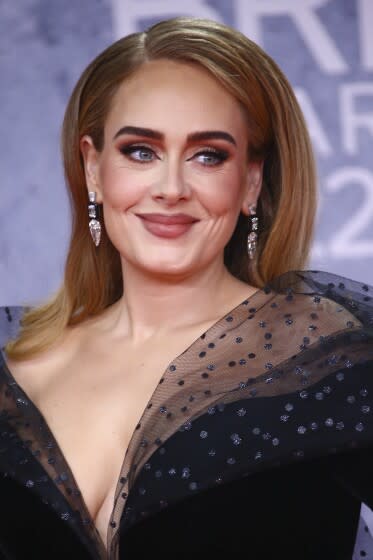 Adele poses for photographers upon arrival at the Brit Awards 2022 in London Tuesday, Feb. 8, 2022. (Photo by Joel C Ryan/Invision/AP)