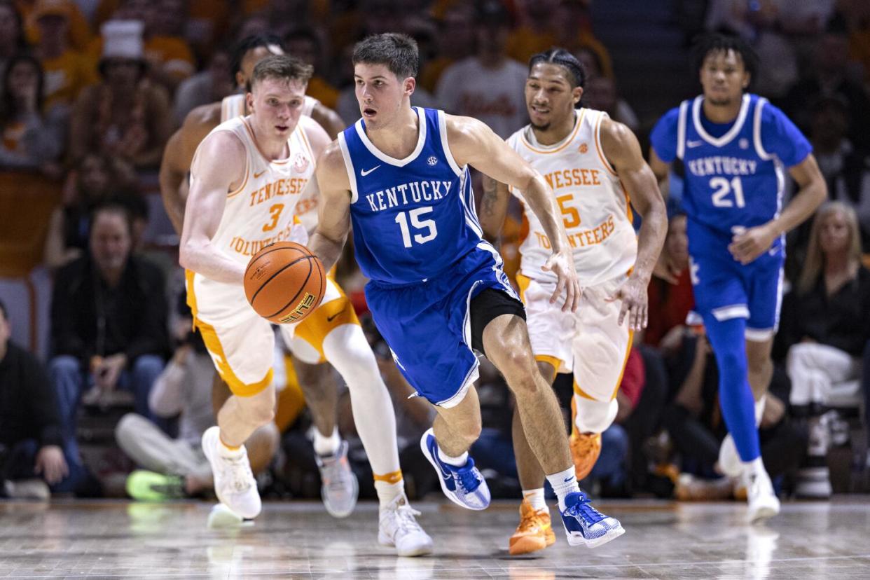 Kentucky guard Reed Sheppard dribbles away from the defense during a game against Tennessee.