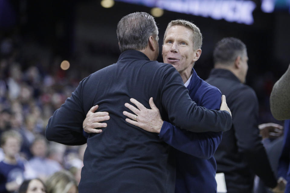 Gonzaga head coach Mark Few, right, and Kentucky head coach John Calipari greet each other before an NCAA college basketball game, Sunday, Nov. 20, 2022, in Spokane, Wash. (AP Photo/Young Kwak)