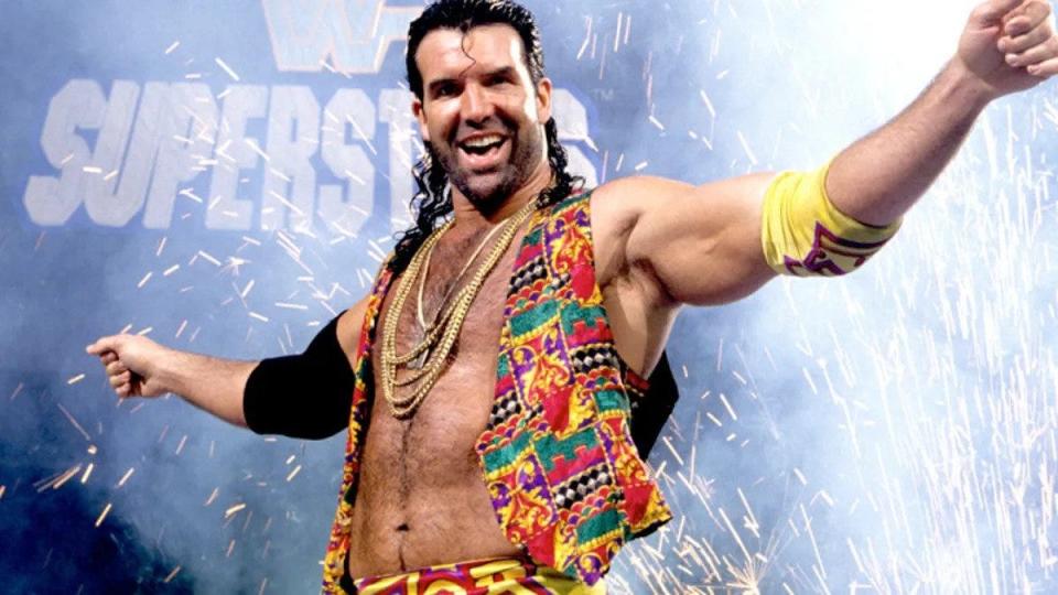 Scott Hall in a colorful vest and gold chain