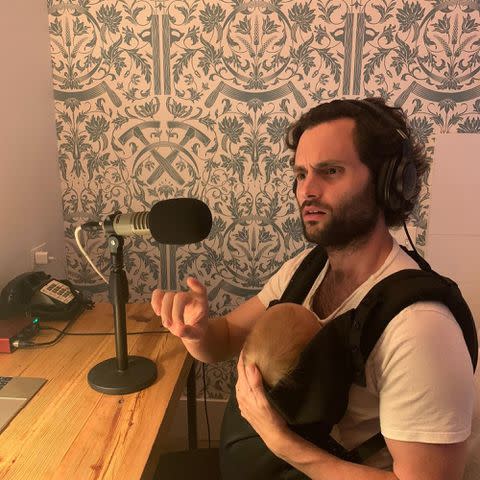 <p>Domino Kirke Instagram</p> Penn Badgley with his son while working