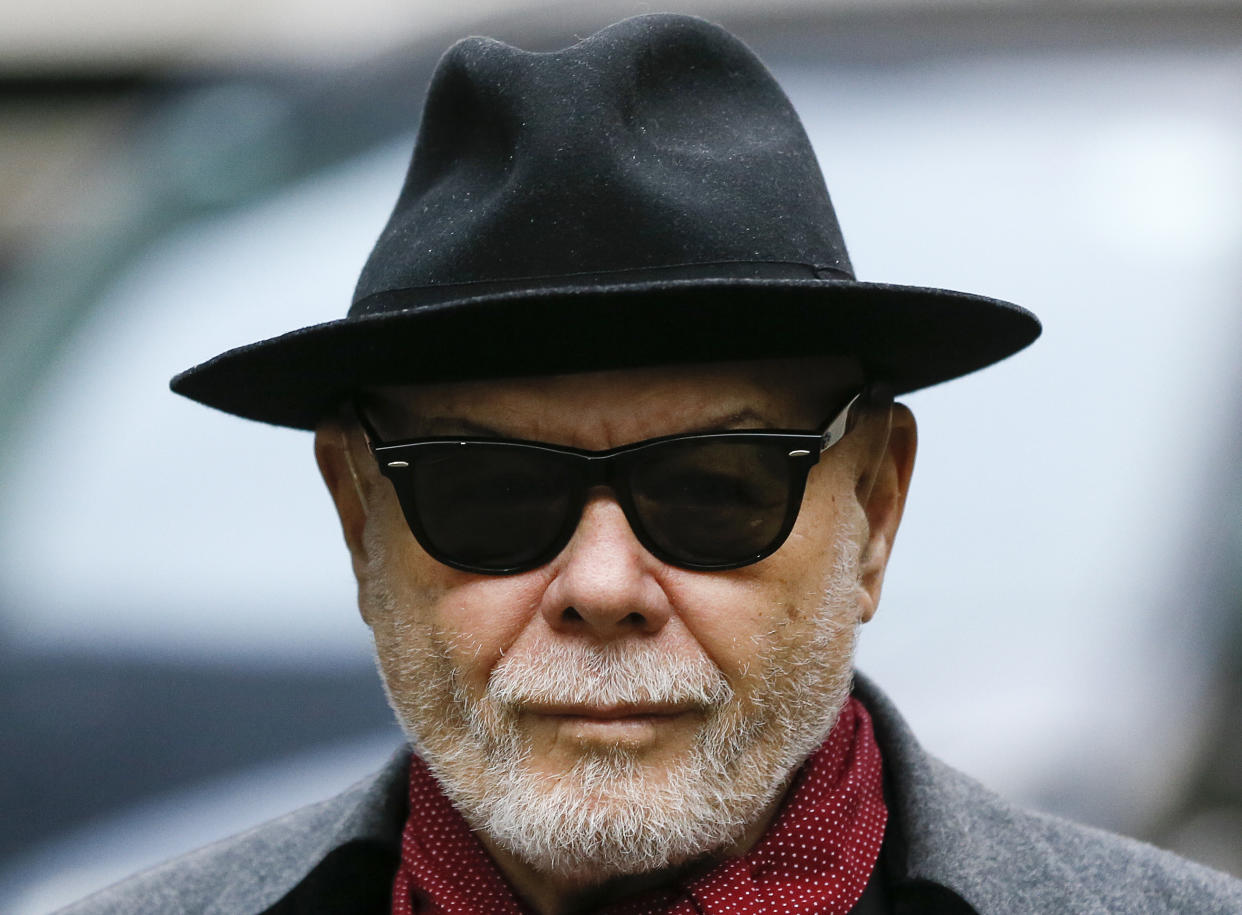 British pop star Gary Glitter, whose real name is Paul Gadd, arrives at Southwark Crown Court in London, on Feb. 4, 2015. (AP Photo/Kirsty Wigglesworth)