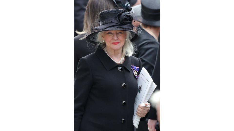 Angela Kelly wearing a black hat and matching clothes to the Queen's funeral