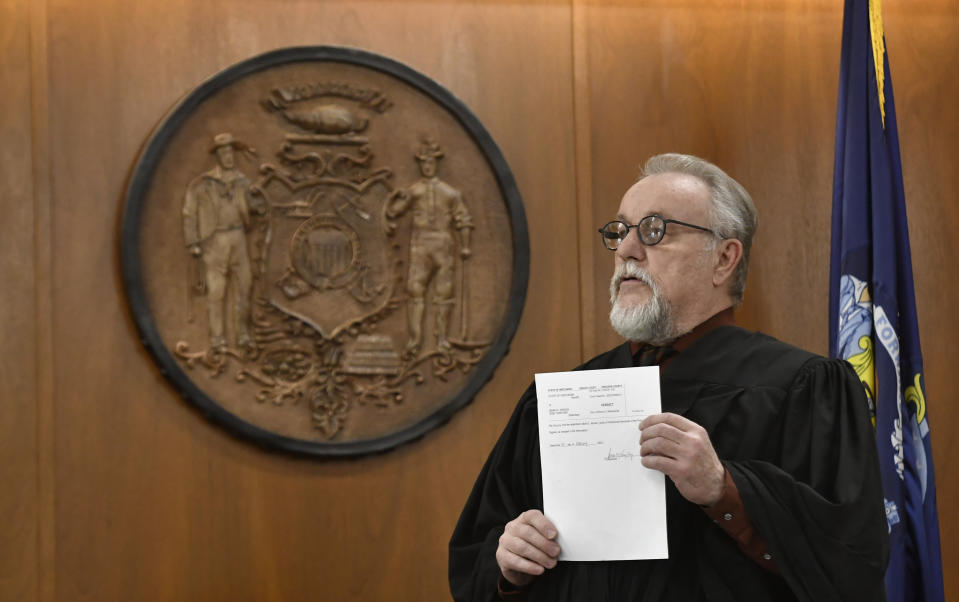 Judge Anthony Milisauskas polls the jury in regard to the guilty verdict in Mark Jensen's trial at the Kenosha County Courthouse on Wednesday, Feb. 1, 2023, in Kenosha, Wis. The Wisconsin Supreme Court ruled in 2021 that Jensen deserved a new trial in the 1998 death of his wife Julie Jensen, who was poisoned with antifreeze. (Sean Krajacic/The Kenosha News via AP, Pool)