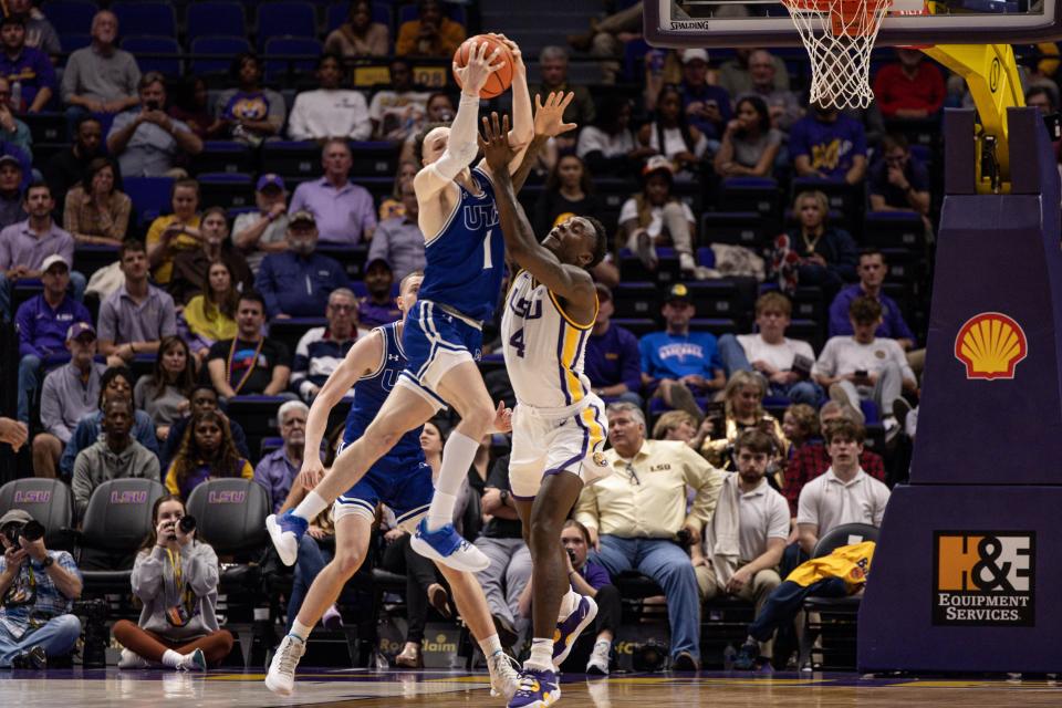 UT-Arlington guard Chendall Weaver, left, collides with LSU center Kendal Coleman while going for the ball last year. Weaver is one of the two most recent transfers to join the Texas program.