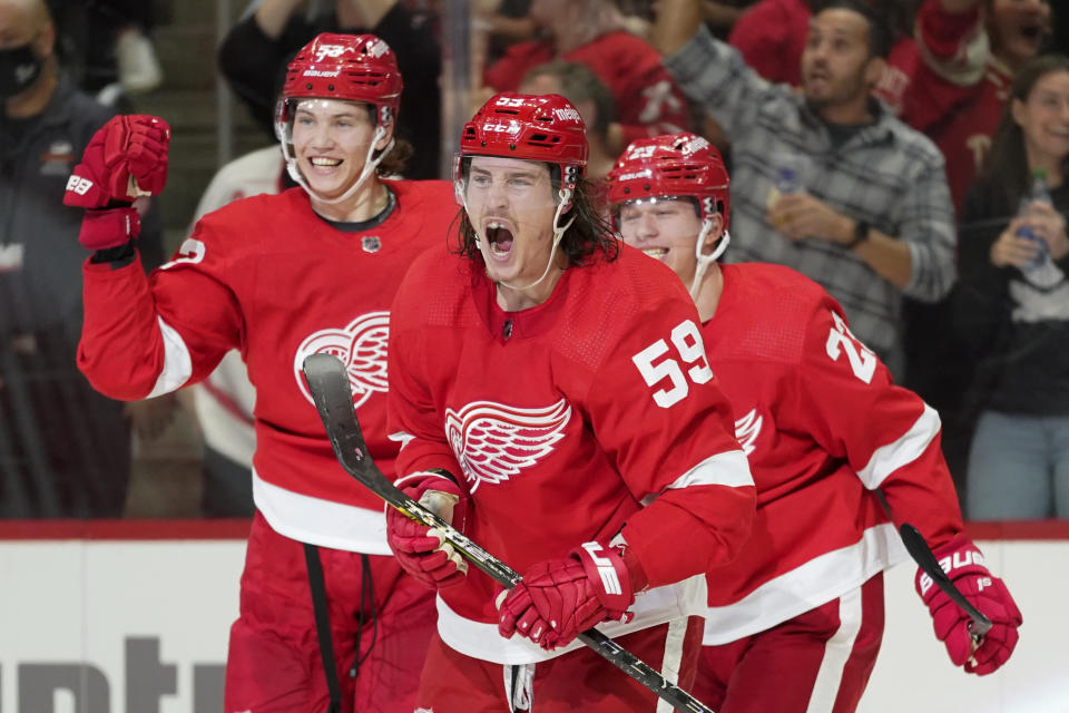 Detroit Red Wings left wing Tyler Bertuzzi (59) celebrate his goal against the Tampa Bay Lightning in the second period of an NHL hockey game Thursday, Oct. 14, 2021, in Detroit. (AP Photo/Paul Sancya)