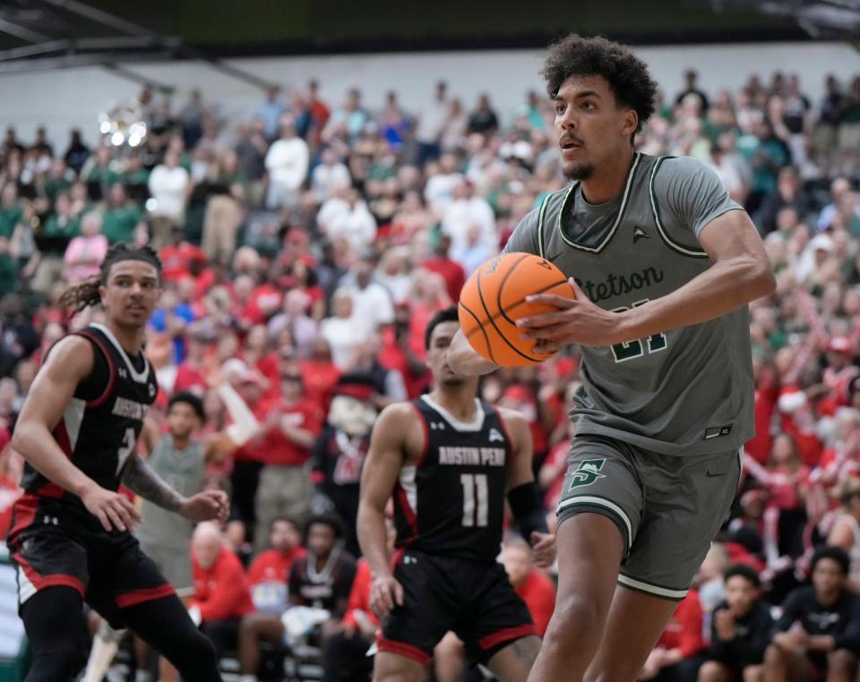 Stetson's Aubin Gateretse looks to pass under the basket during the ASUN Championship game at Edmunds Center in DeLand, Sunday, March 10, 2024.