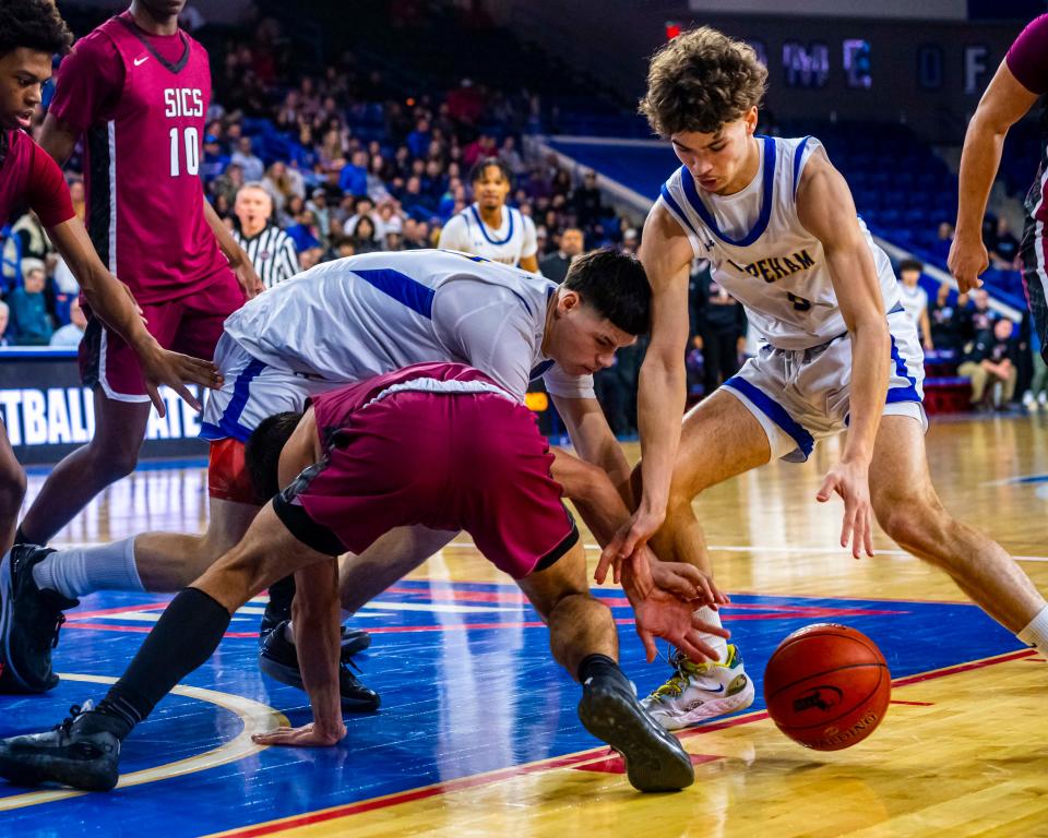 Wareham's Elijah Carrion and Jayce Travers looks to pounce on the loose ball.