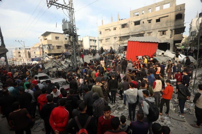 Palestinians search through the rubble after an Israeli strike on the Ali ben Abi Taleb mosque in Rafah in the southern Gaza Strip on Wednesday. Photo by Ismael Mohamad/UPI