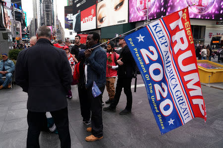 U.S. President Donald Trump supporters gather in Times Square in New York, New York, U.S., March 24, 2019. REUTERS/Carlo Allegri