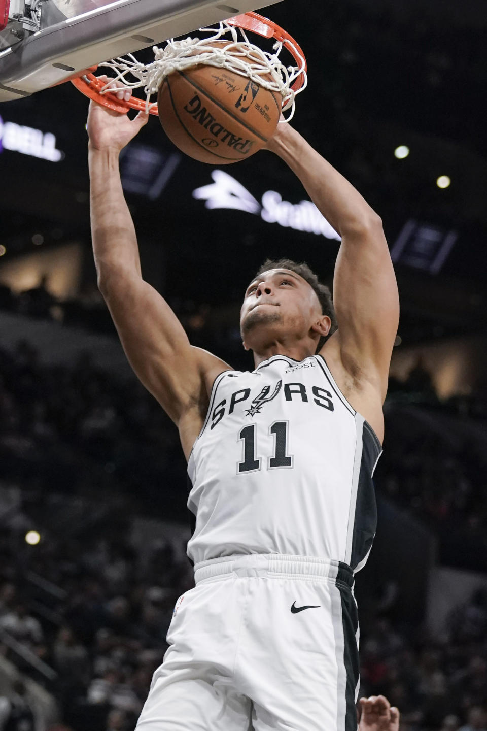 San Antonio Spurs' Bryn Forbes dunks during the second half of an NBA preseason basketball game against the New Orleans Pelicans, Sunday, Oct. 13, 2019, in San Antonio. (AP Photo/Darren Abate)