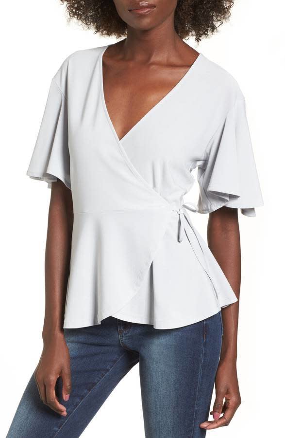 Get it <a href="https://shop.nordstrom.com/s/leith-flounce-sleeve-faux-wrap-top/4740030?origin=category-personalizedsort&amp;fashioncolor=BLUE%20PEARL" target="_blank">here</a>.&nbsp;