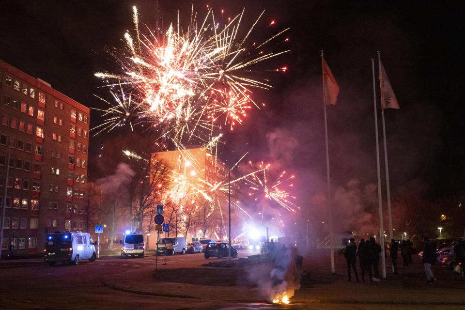 Police vans gather at the scene where unrest broke out in Rosengard in Malmo, Sweden, early Monday, April 17, 2022. The riots broke out following Danish far-right politician Rasmus Paludan’s meetings and planned Quran burnings in various Swedish cities and towns since Thursday. (Johan Nilsson/TT via AP)