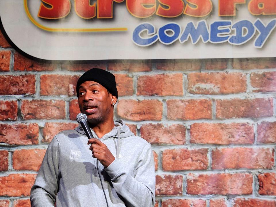 Tony Rock performs on stage at a Comedy Club in New Brunswick, New Jersey.