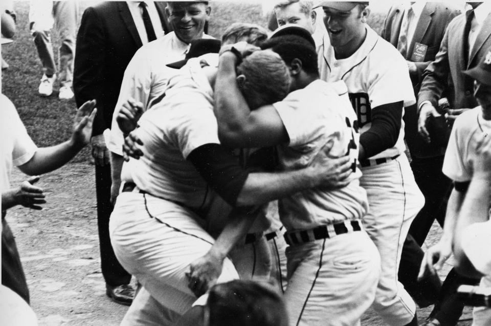 Detroit Tigers pitcher Denny McLain and outfielder Willie Horton embrace on the field after Horton's double scored the winning run against the Oakland Athletics in Detroit, Mich., September 14, 1968. The Tigers' win enabled McLain to chalk up his 30th win of the season and equal a mark set by Dizzy Dean in 1934.