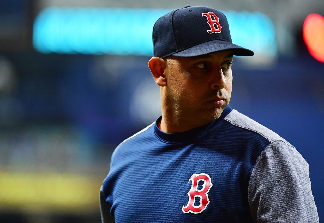 ST PETERSBURG, FLORIDA - SEPTEMBER 20: Manager Alex Cora #20 of the Boston Red Sox looks back after relieving a pitcher against the Tampa Bay Rays at Tropicana Field on September 20, 2019 in St Petersburg, Florida. (Photo by Julio Aguilar/Getty Images)