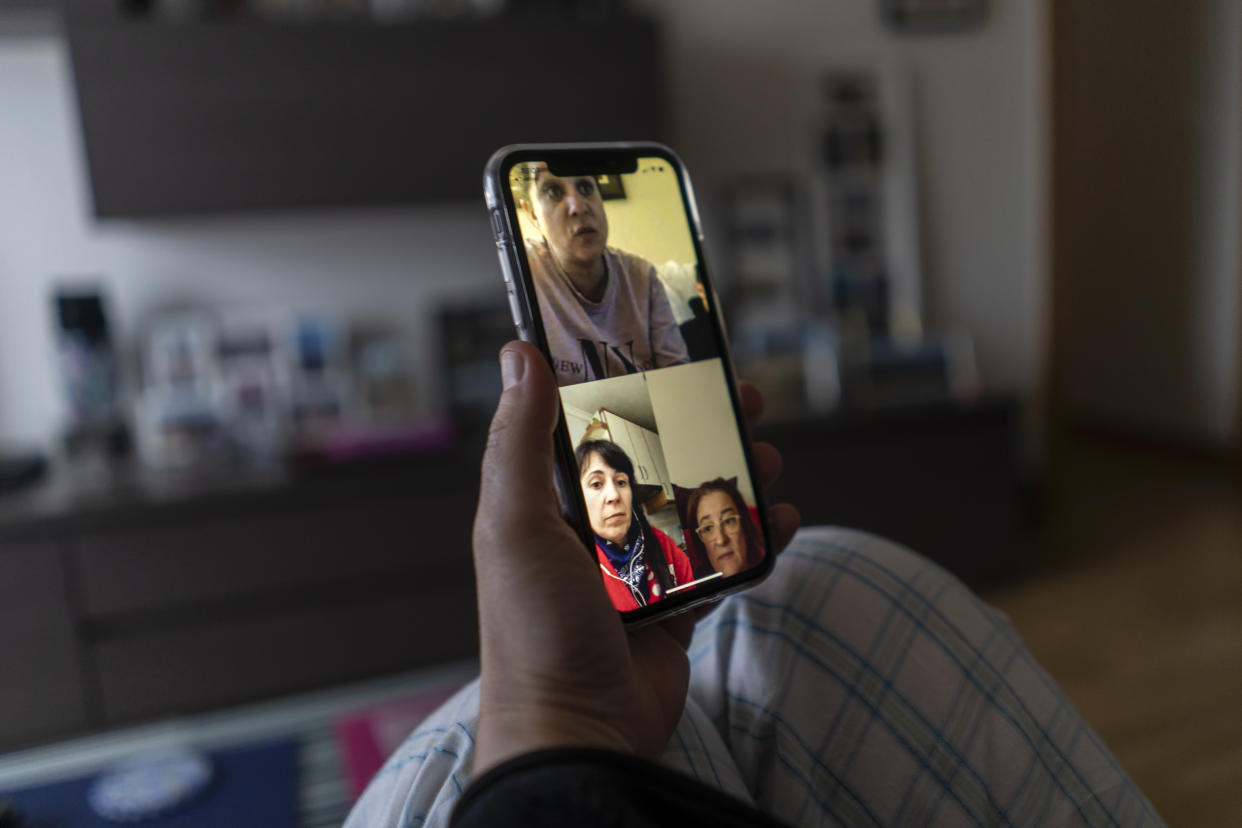 A young woman makes a video call to several friends with her smartphone from her home during the mandatory quarantine decreed by the government as a result of the coronavirus (Covid-19) in Santander (Photo by Joaquin Gomez Sastre/NurPhoto via Getty Images)