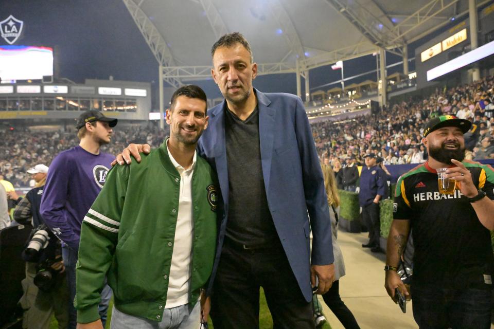 Novak Djokovic poses for a photograph during the game between the L.A. Galaxy and Inter Miami.